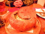 A big big soup in a bread.....very salty