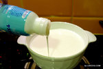 Add yougurt into the warm milk 
(1L milk around 100~150ml yogurt)
