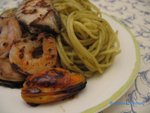 Spaghettie with pesto and assorted seafood