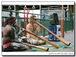 
Street performers, Aborigines on the left
