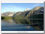 Mountain with a bit of snow and the ferry passing by