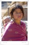 

Big sister with her baby brother. She kept on asking tourists for money. Her face was an unusually sad one we saw in Nepal.