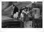 
RELATIVES CLEANSING THEIR BODIES WITH HOLY WATER

