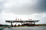 after the tomatoe field, we left &#24211;&#23572;勒 and were heading to 吐&#40065;番.  this was one of those highway toll gate.