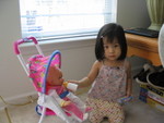 Kelly playing with my toy