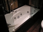 Refurnished washroom of Hotel Lisboa comes with a compact Jacuzzi!