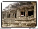 taking pic of wall sculptures inside Angkor Wat