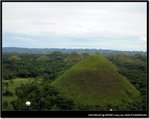 The Chocolate Hills in the summer have their characteristic brown color