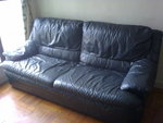 85% Grey three-seat sofa $800