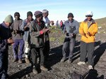 19/11/06 (日)在山上的最後一個早上, 離開 Horombo Hut便會一真落到 Marangu Gate.  所以食完早餐便要付小費于各人, 之後佢地就唱起 Kilimanjaro 歌添.  從左至右, 大廚Patrick, 後面係抬我落山的2位Joseph (認真感激不盡), 前面的領隊Freddy, 及另3位挑夫, 我只知中間的叫Nelson, 真係唔好意思.  
IMG00479