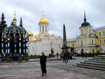 Cathedral of the Holy Trinity (white with a golden dome). On its right is the Vestry, with Pilgrim Shop inside.