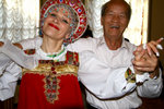 Cheerful couple enjoying Russian folk dance inside Nicholas Palace.