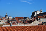 The dome belongs to the Dubrovnik Cathedral. On the right is the St. Catherine's Covent