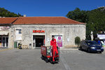 Konzum, a famous supermarket chain in Croatia... and the boy was transporting some goods around... looks fun!