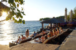 The guys were having a good time here... the beer, the sea and the sunset!