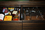 All the alchohol and glasses were found inside the drawer