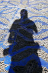 My shadow on the blueish gound of the blueish town