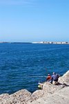 People fishing in the seafront corniche