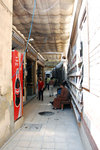 A large and almost certain a rip-off souvenir shop in the middle of the alleyway.