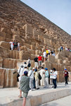 The only part you can climb is to the entrance of the pyramid
