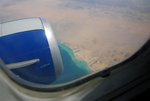 View of the Sinai peninsula from the plane above. The water of the Red Sea is indeed that clear!