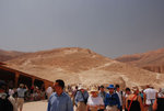 Never really know what the building on the left is except that it provides shade for people who are melting. Notice people are climbing the hill at the back.