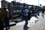 The merchants were selling their catches along the port
