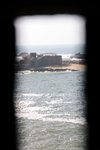 View of an island through the slits inside the tower