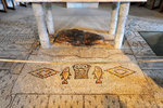 Below the altar is the 5th century mosaic of 2 fishes flanking a basket containing 5 loaves of bread and also the block of limestone on which the miraculous meal was laid.