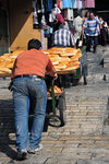 Merchants using the ramp to push their carts uphill