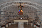 An altar inside the grotto. You can see there are stained glasses in here