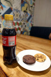 Lounge@Male International Airport... the only food we found were some biscuits. The coke was made locally in Maldives though. Does that mean the water is from the sea?