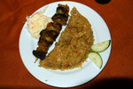 Kebab with fried rice and coleslaw