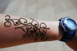 At the entrance a girl grabbed my arm and said she would give me a "free" henna. When she finished, she asked me for money. Henna is modernized by using a pen that  ejects a coloured creamy form of substance while she draws.