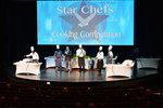 This competition had 2 male contestants who couldn't cook, helped by two chefs, and were being challenged by the head chef