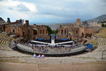 Teatro Greco, the perfect horseshoe-shaped theatre, suspended between sea and sky, with a breathtaking view of Mt Etna and Bay of Schiso
