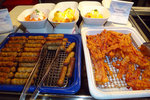 Sausages and crispy bacons. At the back are egg benedicts