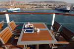 Enjoying breakfast in Piraeus, port of Athens