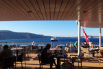 Enjoying the breakfast outside with the cliff and the white houses of Santorini in the background