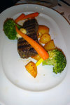 Pan Seared Aged Sirloin Steak with Roasted Potatoes, Broccolio Florets and Herbed Compound Butter