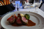 Roasted Colorado Rack of Lamb served with Mashed Potatoes, Steamed Broccoli Florets, Glazed Baby Carrots and Rosemary Lamb Jus