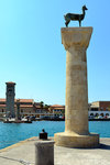 These are the two statues of the stag and the doe, that marks the place where the feet of the Colossus of Rhodes stood.