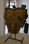 Campanian armour in gilded bronze. Cuirass Armor made up of a drill plate and a backing decorated by the head helmeted Minerve goddess.
