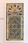 Panel with symmetric florid and architectural decoration, inscribed under an arch supported by two columns surrounded by two Corinthians capitals