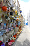 If you see a wall covered with ceramic pots, then you know there is a shop nearby