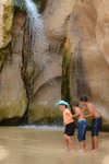 Local kids playing around with the fall. With that amount of water, perhaps the adult could just get a decent shower?