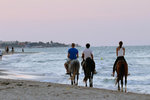 It must be an awesome experience riding along the beach during sunset (and especially with a young and attractive girl)