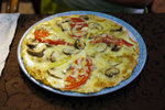 Sadly, this is not an omelete but a cheesy pizza...