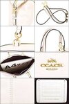 Brand New Coach White Leather Satchel Crossbody Tote F59325 Chalk Leather Satchel 16.25"L x 4.75"W x 9.75"H  colors: chalk lenox satchel New With Tags Pebble leather Inside zip, cell phone and multifunction pockets Zip-top closure, fabric lining Handles with 5" dropDetachable strap with 37 1/2" for shoulder or crossbody wear16 1/4" (L) x 9 3/4" (H) x 4 3/4" (W)AuthenticMSRP: $395 +taxesNOW CAD $ 250 