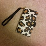  Brand New No Tag COACH Ocelot Print Leather Phone Wristlet Clutch Wallet F53567Local pick up and Cash onlyRetail was CDN $95 + taxes = $106.40NOW CDN $50STYLE: F53567DETAILSPrinted haircalfSnap closure, fabric liningInside cell phone and multifunction pocketFive credit card pocketsstrap attachedOutside open pocket5 3/4 (L) x 3 1/4 (H)
